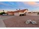 Single-Gathering home with an attached garage and beautiful desert landscaping. The house has a spacious yard with a private entrance at 14418 S 42Nd St, Phoenix, AZ 85044