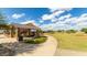 Community playground with covered picnic area, barbecue grills, and open green space at 14657 W Sand Hills Rd, Surprise, AZ 85387