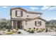 Charming two-story home featuring a low-maintenance desert landscape and neutral-colored exterior at 14659 W Sand Hills Rd, Surprise, AZ 85387
