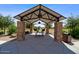 Shaded picnic area with barbecue grills and stone pillars in a community park at 14659 W Sand Hills Rd, Surprise, AZ 85387