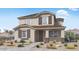 Charming two-story home with neutral paint, brown shutters, and low-maintenance landscaping at 14663 W Sand Hills Rd, Surprise, AZ 85387