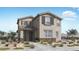 Charming two-story home with neutral exterior, stylish shutters, and professionally landscaped front yard at 14665 W Sand Hills Rd, Surprise, AZ 85387