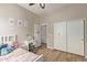 Lovely bedroom boasts wood floors, a ceiling fan, and ample closet space at 15088 W Coolidge St, Goodyear, AZ 85395