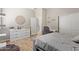 Inviting bedroom features wood floors, and a dresser at 15088 W Coolidge St, Goodyear, AZ 85395