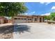 Well-maintained single-Gathering home with a spacious three-car garage and lush landscaping at 15088 W Coolidge St, Goodyear, AZ 85395