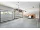 This spacious garage features a windowed overhead door, storage, and room for multiple cars at 15088 W Coolidge St, Goodyear, AZ 85395