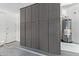 Spacious garage featuring ample storage cabinets and a modern water heater for convenience and organization at 15088 W Coolidge St, Goodyear, AZ 85395