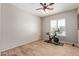 Inviting spare room with a ceiling fan and bike at 15088 W Coolidge St, Goodyear, AZ 85395