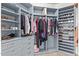 Spacious walk-in closet with custom shelves and drawers provides ample storage at 15088 W Coolidge St, Goodyear, AZ 85395