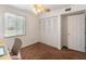 Bright bedroom featuring a ceiling fan, window with blinds, and a closet for ample storage at 1525 E Southern Ave, Tempe, AZ 85282