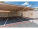 Covered carport parking area with designated spots and security fencing for added protection at 1525 E Southern Ave, Tempe, AZ 85282