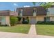 Charming two-story home with lush green lawn and mature trees enhancing its curb appeal at 1525 E Southern Ave, Tempe, AZ 85282