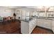 Open kitchen layout with modern island and view into the dining area at 1525 E Southern Ave, Tempe, AZ 85282