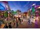 Lively outdoor mall with people strolling, lit with vibrant, colorful lights and palm trees at 1525 E Southern Ave, Tempe, AZ 85282
