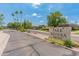 A sunny street view of the Park Riviera community entrance with desert landscaping and palm trees at 1525 E Southern Ave, Tempe, AZ 85282