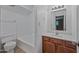 This is a full bathroom with a tub/shower combo and wood vanity at 16602 N 25Th St # 114, Phoenix, AZ 85032