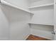 This walk-in closet offers ample storage with shelving and wood floor at 16602 N 25Th St # 114, Phoenix, AZ 85032