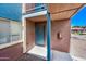 Apartment entryway with blue door and trim at 16602 N 25Th St # 114, Phoenix, AZ 85032