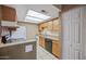 Galley style kitchen with appliances and tile floors at 16602 N 25Th St # 114, Phoenix, AZ 85032