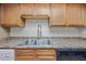 Close-up of the kitchen sink with updated appliances at 16602 N 25Th St # 114, Phoenix, AZ 85032