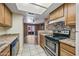 Kitchen with stainless steel appliances and plenty of cabinet space at 16602 N 25Th St # 114, Phoenix, AZ 85032