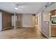 Spacious living room with view to kitchen and hallway at 16602 N 25Th St # 114, Phoenix, AZ 85032