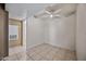 This room features tile floors, neutral colors, and a ceiling fan at 16602 N 25Th St # 114, Phoenix, AZ 85032