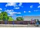 Bright playground with swings and a slide set against a blue sky, perfect for Gathering fun at 16602 N 25Th St # 114, Phoenix, AZ 85032
