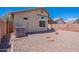 Gravel backyard featuring a small fire pit and access to the side yard at 17403 N 16Th Pl, Phoenix, AZ 85022
