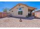 Private backyard featuring desert landscaping and a covered patio ideal for outdoor entertaining at 17403 N 16Th Pl, Phoenix, AZ 85022