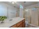 Bright bathroom features a vanity, a mirror, and a separate shower enclosure at 17403 N 16Th Pl, Phoenix, AZ 85022