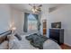 Comfortable bedroom with large window, soft lighting, and ensuite bathroom access at 17403 N 16Th Pl, Phoenix, AZ 85022