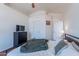 Bright bedroom featuring white walls, hardwood flooring, and a large dresser at 17403 N 16Th Pl, Phoenix, AZ 85022