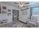 Adorable Bedroom featuring a crib, chair, and decor at 17403 N 16Th Pl, Phoenix, AZ 85022