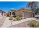 Charming single-story home with a two-car garage, desert landscaping, and a red tile roof at 17403 N 16Th Pl, Phoenix, AZ 85022