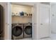 Laundry room features side-by-side washer and dryer for convenience at 17403 N 16Th Pl, Phoenix, AZ 85022