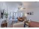 Open-concept living area with comfortable seating, wooden floors, and seamless flow into the dining room at 17403 N 16Th Pl, Phoenix, AZ 85022