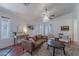 Cozy living room featuring a ceiling fan, comfortable seating, and stylish decor at 17403 N 16Th Pl, Phoenix, AZ 85022