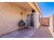 Covered patio featuring an outdoor kitchen and sliding glass door entrance at 17403 N 16Th Pl, Phoenix, AZ 85022