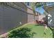 Backyard putting green with desert landscaping, string lights, and lounge seating offers outdoor fun at 1749 E Medlock Dr, Phoenix, AZ 85016