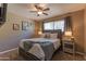 Comfortable bedroom with queen bed, ceiling fan and window at 1749 E Medlock Dr, Phoenix, AZ 85016