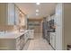 Bright kitchen with stainless steel appliances, ample counter space, and tile flooring at 1749 E Medlock Dr, Phoenix, AZ 85016