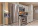 Modern kitchen featuring stainless steel appliances and white cabinetry at 1749 E Medlock Dr, Phoenix, AZ 85016