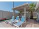 Inviting outdoor patio area with lounge seating and a shaded pergola at 1749 E Medlock Dr, Phoenix, AZ 85016