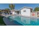Inviting backyard pool with a covered patio and lounge chairs, perfect for relaxation and entertaining at 1749 E Medlock Dr, Phoenix, AZ 85016