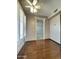 Bedroom with hardwood floors, white trim and access to additional room at 17841 N Del Webb Blvd, Sun City, AZ 85373