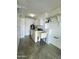 Bright laundry room with washer, dryer, utility sink, built-in cabinets, and shelving at 17841 N Del Webb Blvd, Sun City, AZ 85373