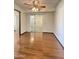 Bright living room with hardwood floors and large sliding glass doors at 17841 N Del Webb Blvd, Sun City, AZ 85373