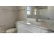 Well-lit bathroom featuring a white vanity with a modern sink and a large mirror at 22352 W Gamble Ln, Wittmann, AZ 85361