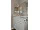 Bright bathroom featuring a modern vanity, faucet, and a large mirror with views at 22352 W Gamble Ln, Wittmann, AZ 85361